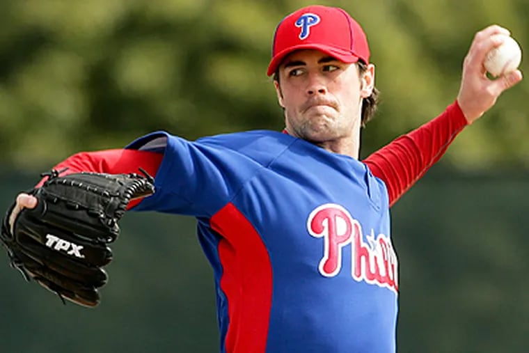 Phillies' pitcher Cole Hamels throws the baseball during spring training at Bright House Field in Clearwater. (Yong Kim / Staff Photographer)