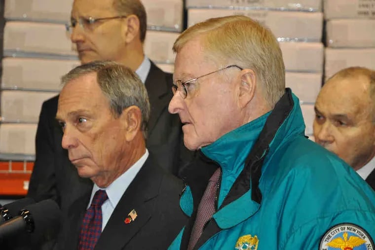 NYC Mayor Michael Bloomberg (left) and Sanitation Commissioner John Doherty hold a news conference yesterday in the Bronx.