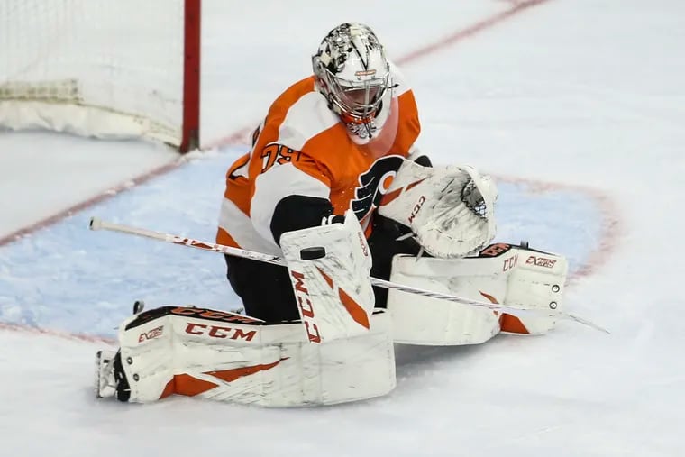 Flyers' goalie Carter Hart makes a stop against the Sharks during the second period at the Wells Fargo Center in Philadelphia, Tuesday,  February 25, 2020.
