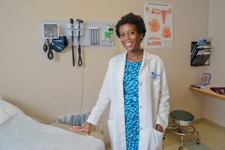 Dr. Afua Mintah MD speaks about her practice in an exam room Tuesday, July 31, 2018 in Southampton, Pennsylvania. Dr. Mintah is a young female OB-GYN who is watching the older men retire and seeing few men choosing residencies in OB-GYN.