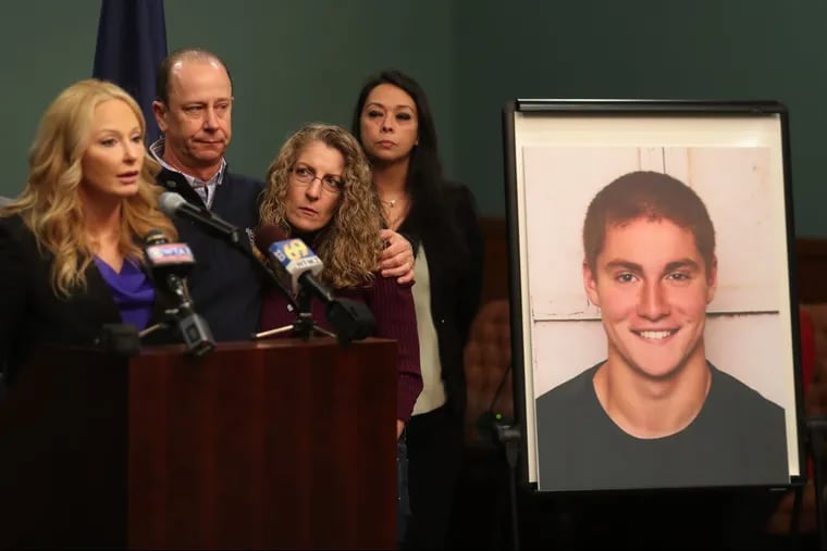 FILE – In this May 5, 2017, file photo, Centre County District Attorney Stacy Parks Miller, left, announces findings an investigation into the death of Penn State University fraternity pledge Tim Piazza, seen in photo at right, as his parents, Jim and Evelyn Piazza, second and third from left, stand nearby during a news conference in Bellefonte, Pa. A preliminary hearing is set to resume Thursday, Aug. 10, 2017, for a fourth day for members of Penn State University’s Beta Theta Pi fraternity chapter, accused in the Feb. 4, 2017, death.