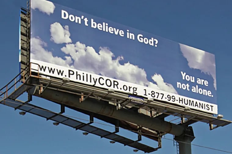 A local businessman paid for an atheist billboard on I-95 that seems to float above I-95 north. (Michael Bryant/Inquirer)