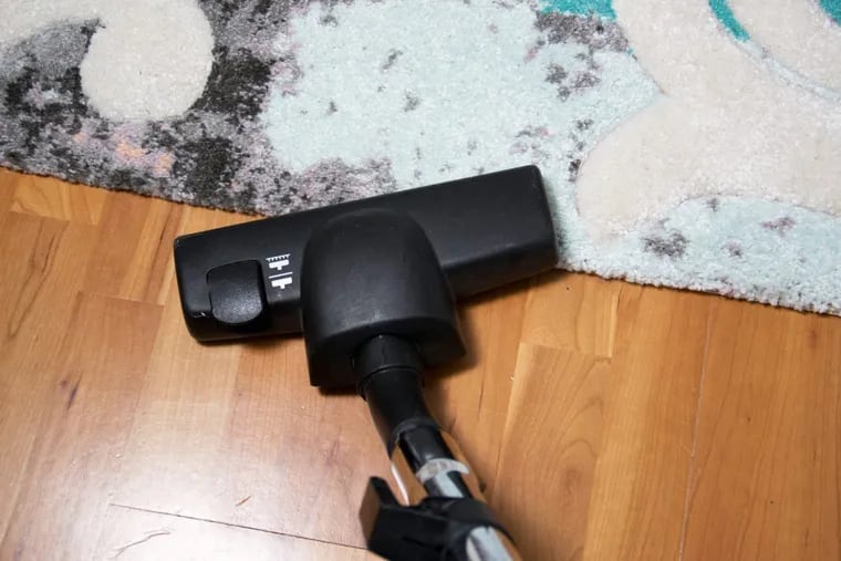 Experts recommend using a vacuum with a HEPA filter.