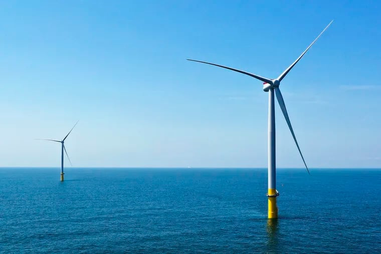 Two of the offshore wind turbines that have been constructed off the coast of Virginia Beach, Va., are viewed June 29, 2020. South Jersey is set to become the site of hundreds of offshore wind turbines, generating clean energy to help power the state. That's a good thing, argues Ed Potosnak.