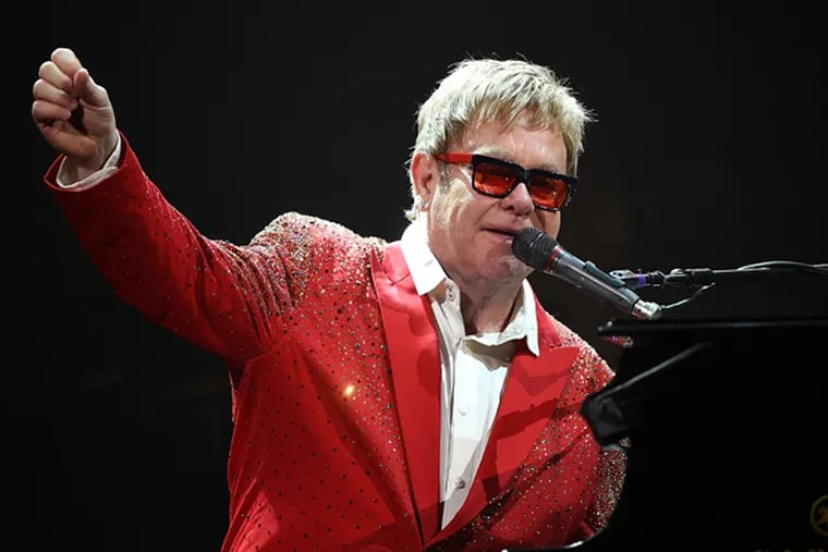 Elton John performs on Dick Clark's New Year's Rockin' Eve with Ryan Seacrest 2015 on December 31, 2014 in New York City.