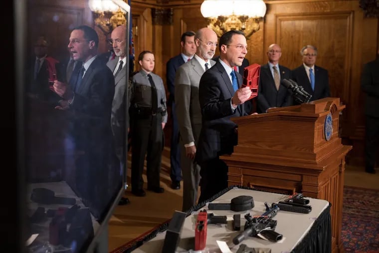 Pennsylvania Attorney General Josh Shapiro speaks as Gov. Tom Wolf stands behind him at a December news conference about the growing threat of "ghost guns."