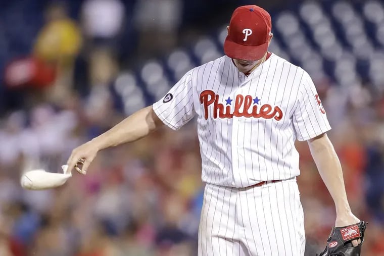Phillies pitcher Jeremy Hellickson tosses the rosin bag after the Milwaukee Brewers scored four runs in the third-inning Saturday, July 22, 2017 in Philadelphia. The Phillies lost to the Brewers, 9-8.