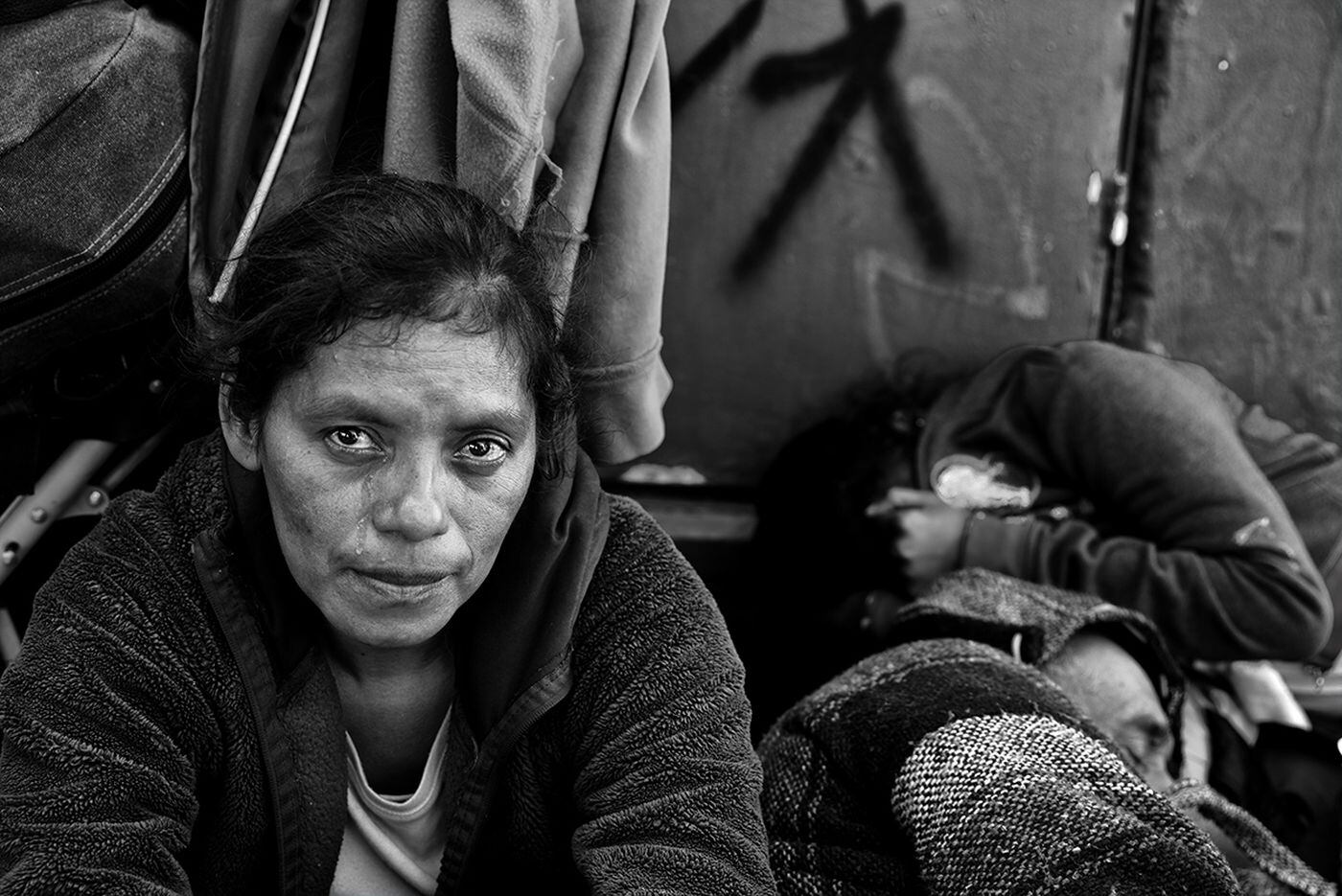 A woman cries while talking about joining the migrant caravan in Mexico with Philadelphia photographer Ada Trillo.