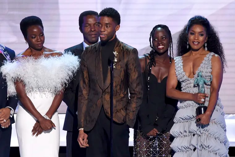 (From left) Danai Gurira, Isaach de Bankole, Chadwick Boseman, Lupita Nyong'o, and Angela Bassett from the cast of "Black Panther," accept the award for outstanding performance by a cast in a motion picture at the Screen Actors Guild Awards on Sunday.