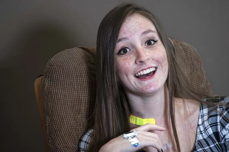 Hannah Mountz, 15, laughs on Thursday, Feb. 26, 2015, in her Kansas City home. Hannah recently received the region's first pediatric heart transplant at Children's Mercy Hospital.
