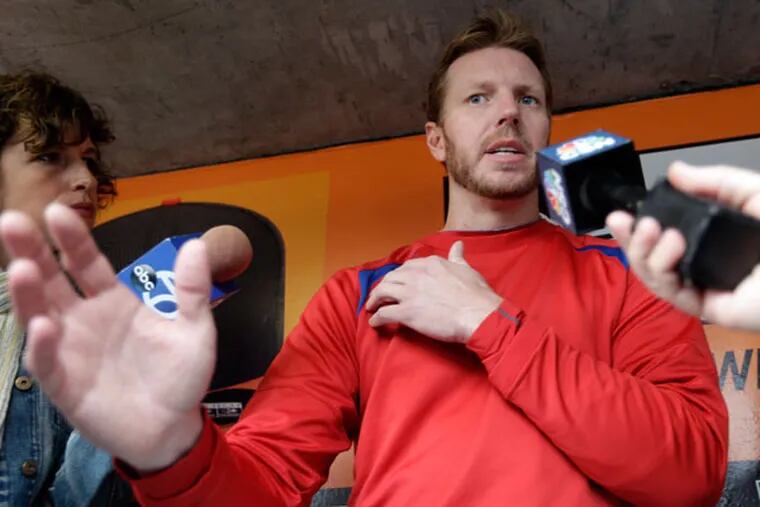 Roy Halladay talks about an injury right shoulder as he speaks with the media in the dugout before a baseball game against the San Francisco Giants on Wednesday, May 8, 2013 in San Francisco. He will have arthroscopic surgery to repair a bone spur in his the shoulder. (Marcio Jose Sanchez/AP)
