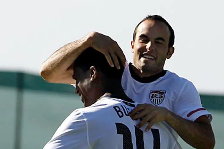 U.S.'s Landon Donovan, right, and Edson Buddle are hoping to shock the world with a win over England. (AP Photo / Elise Amendola)