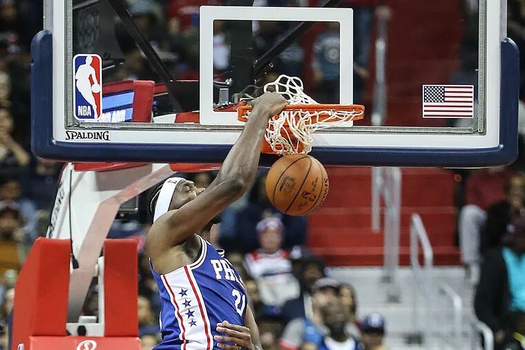 Sixers’ Joel Embiid dunks against the Wizards.
