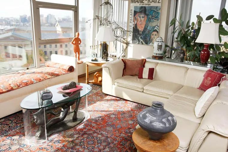 Bebe Weiss' living room is full of art: The coffee table at left, pottery at right, and a wide view of the Art Museum.