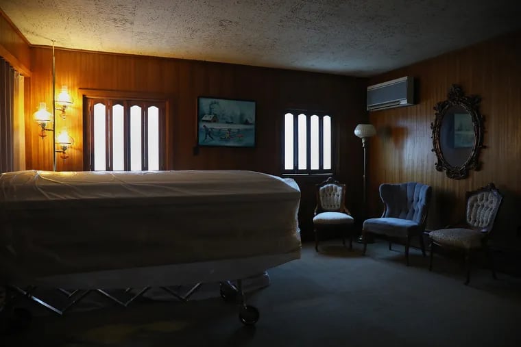 An empty casket sits in a room at Heller-Hoenstine Funeral Home in Lewistown, Pa., in December 2020.