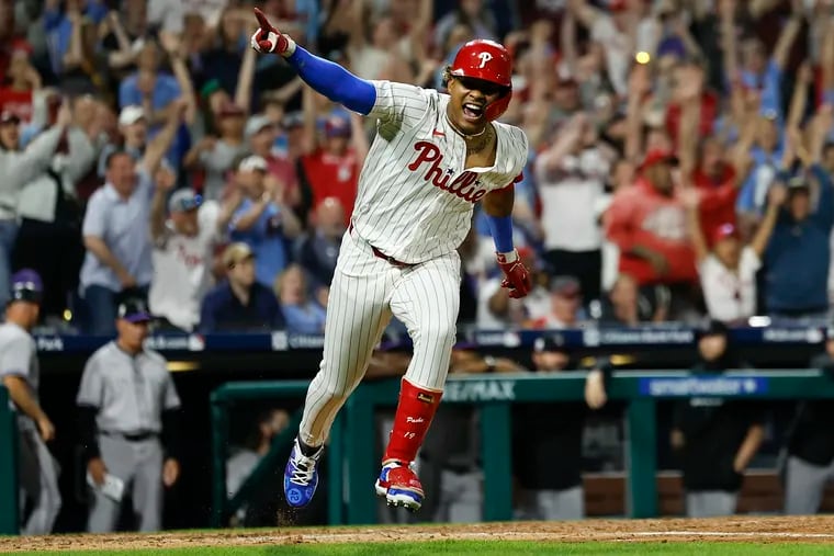 Phillies Cristian Pache celebrates after hitting the game winning 10th inning single to beat the Colorado Rockies, 2-1.