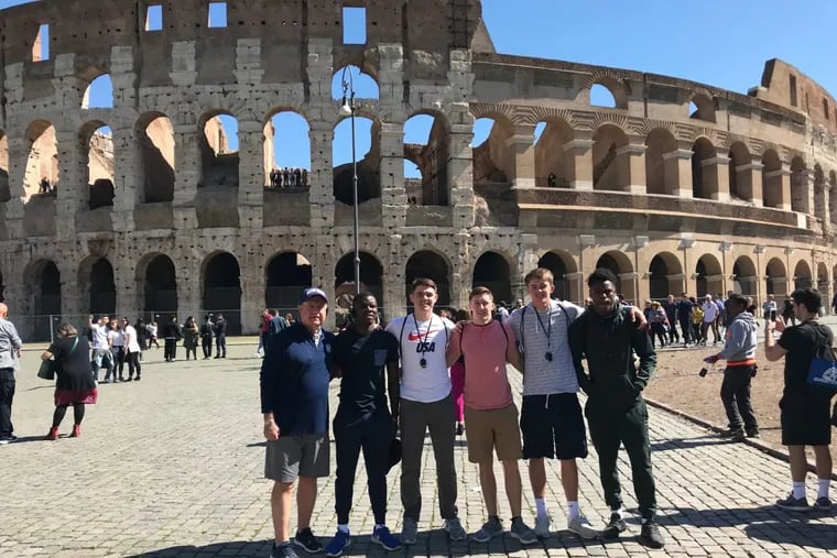 Team Stars &amp; Stripes  coach Bill Gallagher (far left) poses with (from left) Penn Charter’s John Washington and Owen Peters, Father Judge’s Sean Cunningham, Springside Chestnut Hill’s Jack Elliott, and Cheltenham’s Jordan Gyabaah in front of the Coliseum.