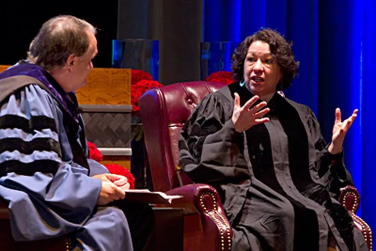 Justice Sonia Sotomayor converses with Michael A. Fitts, dean of the University of Pennsylvania law school, at the dedication of Golkin Hall. ED HILLE / Staff