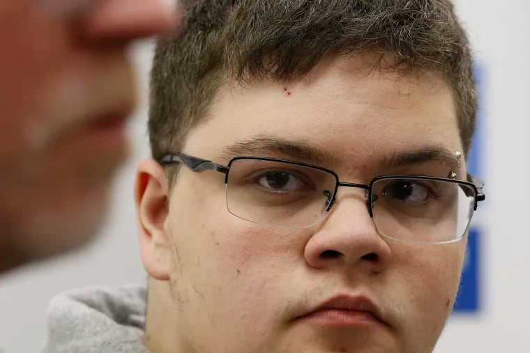 FILE - In this March 6, 2017, file photo, Gloucester County High School senior Gavin Grimm, a transgender student, listens to a speaker during a news conference in Richmond, Va. Grimm is continuing to sue the Gloucester County School Board in Virginia over a policy that banned him from using the boys' bathrooms. He's now trying to amend the suit to include the matter of his unchanged transcripts.