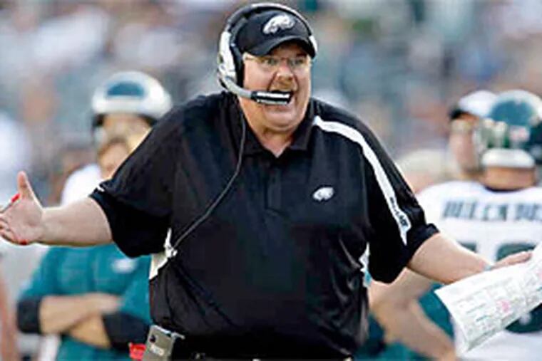 Eagles coach Andy Reid reacts to a fourth-quarter penalty . Later, he called his team's play &quot;absolutely horrendous,&quot; but took the ultimate blame. &quot;I have to make sure this thing is right,&quot; he said. (David Maialetti / Staff Photographer
