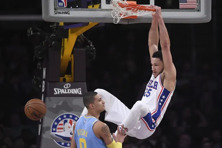 Philadelphia 76ers guard Ben Simmons dunks over Los Angeles Lakers forward Kyle Kuzma during the teams’ meeting at the Staples Center earlier this season.