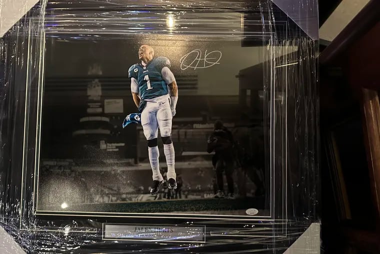 This signed, framed photo of Eagles quarterback Jalen Hurts was stolen from an ALS charity event in South Philly on Saturday.