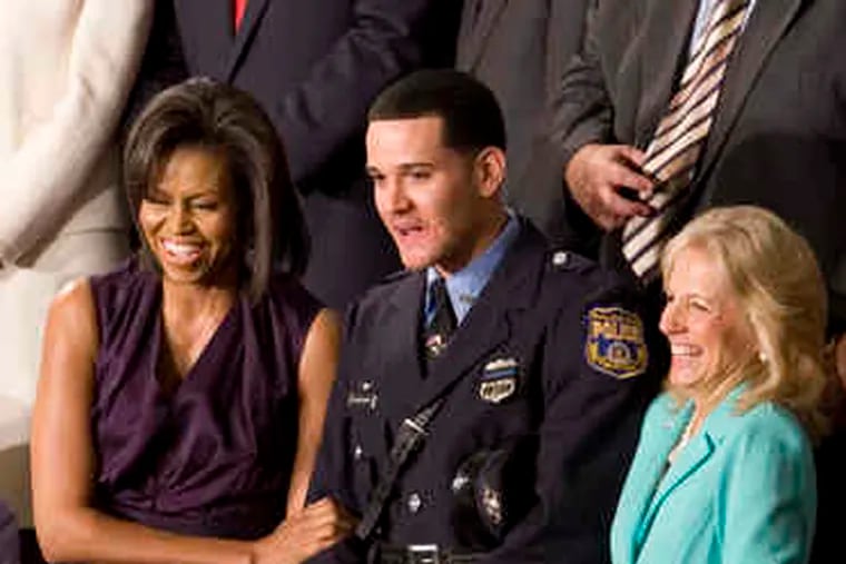 Officer Richard DeCoatsworth, part of yesterday's confrontation, attended a presidential address with Michelle Obama and Jill Biden, wife of Vice President Joe Biden, earlier this year.