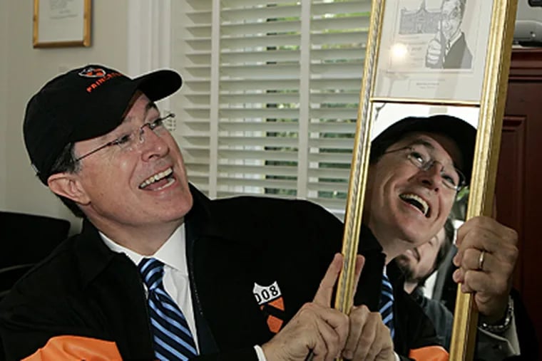Colbert, sporting a Princeton cap and jacket, holds up the mirror-mounted "Vanity" award presented to him after his Class Day address.