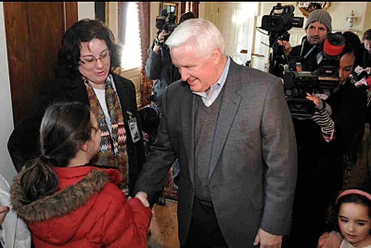 Gov. Corbett greets guests outside the family dining room at the governor's residence. Corbett's new home has 32 rooms; he said he'd never lived in a house with more than 1 1/2 closets. (JASON MINICK / Associated Press)