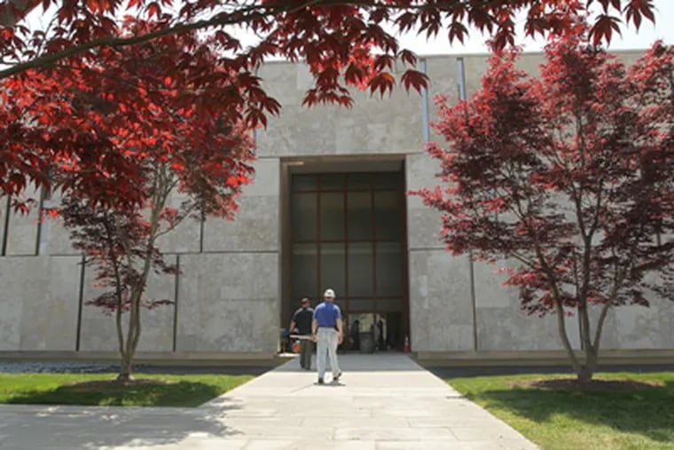 Japanese maples help frame the walkway up to the entrance of the Barnes Foundation, which has moved from Merion to its new and controversial location on the Benjamin Franklin Parkway. (Michael Bryant / Staff Photographer)