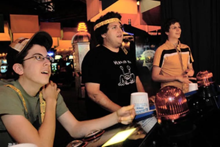 &quot;Superbad&quot; stars (from left) Christopher Mintz-Plasse, Jonah Hill and Michael Cera play a video game at Dave & Busters. Before the teen comedy even opens, they are being recognized.