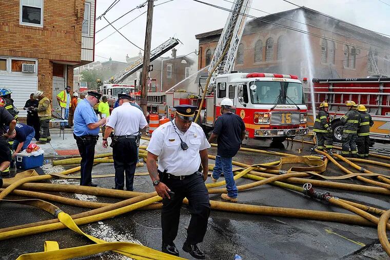 Philadelphia firefighters work to put out a fire at the American Legion Post 396 in the 2300 block of Orthodox Street in the Bridesburg neighborhood May 30, 2016.