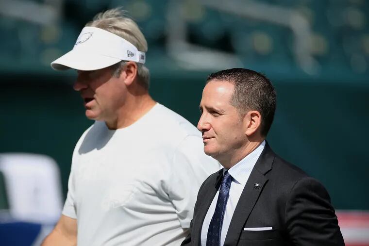 Eagles head coach Doug Pederson, left, walks with general manager Howie Roseman before a game against the Washington Redskins at Lincoln Financial Field in South Philadelphia on Sunday, Sept. 8, 2019.
