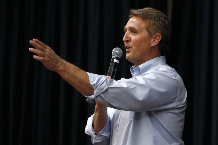 Sen. Jeff Flake takes a question from the audience during a town hall in April in Mesa, Ariz.