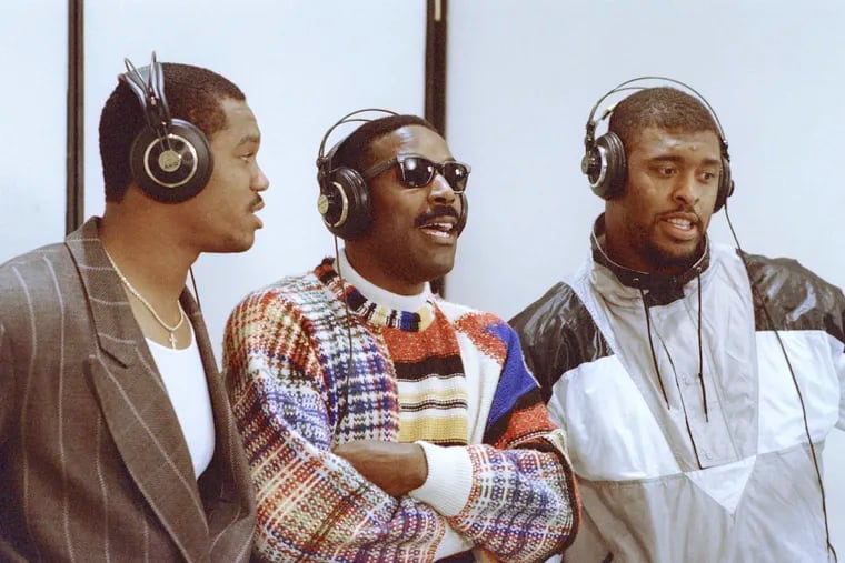 Eagles stars (from left) Randall Cunningham, Mike Quick, and Reggie White gather to record “Buddy’s Watching You,” a rap music video, in 1988.