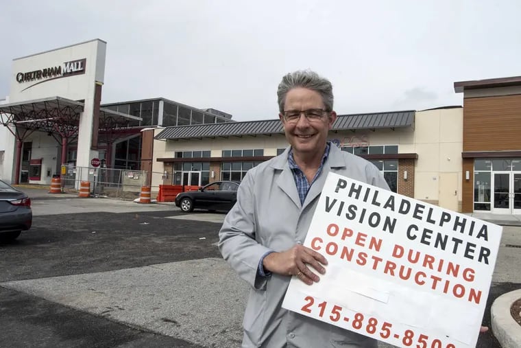 David Boisselle, 57, owner of the Philadelphia Vision Center, stands in the Cheltenham Mall&#039;s parking lot. The mall is being converted to an outdoor mall.