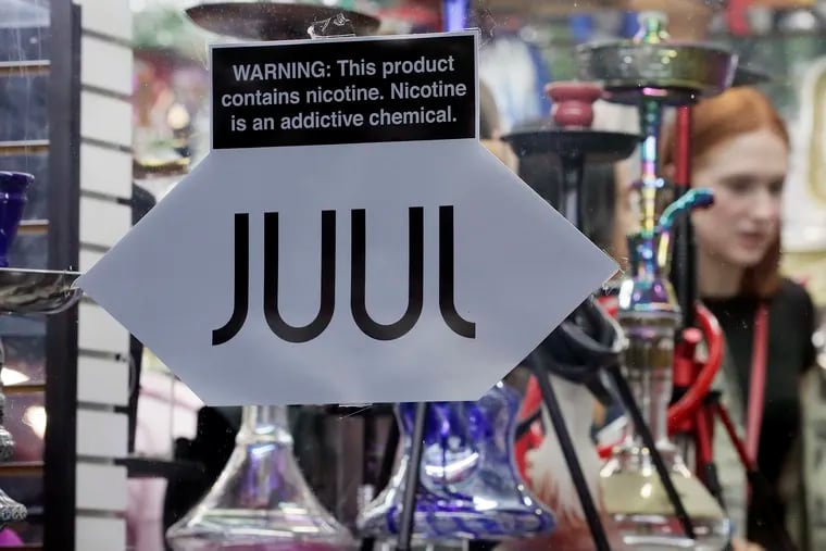 JUUL products advertised for sale at this store on South Street in Philadelphia on Sept. 26, 2019.