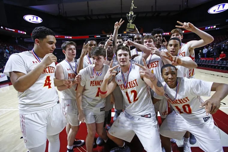 Penncrest players, some flashing “2” signs for two straight district titles, celebrate after winning the District 1 Class 5A championship with a 50-28 victory over Bishop Shanahan on Saturday.