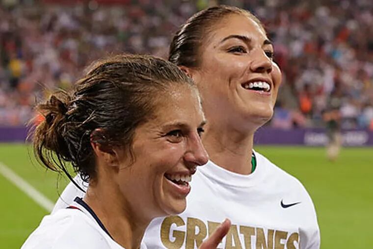 Carli Lloyd scored both goals and Hope Solo delivered a shutout in the gold medal game. (Ben Curtis/AP)