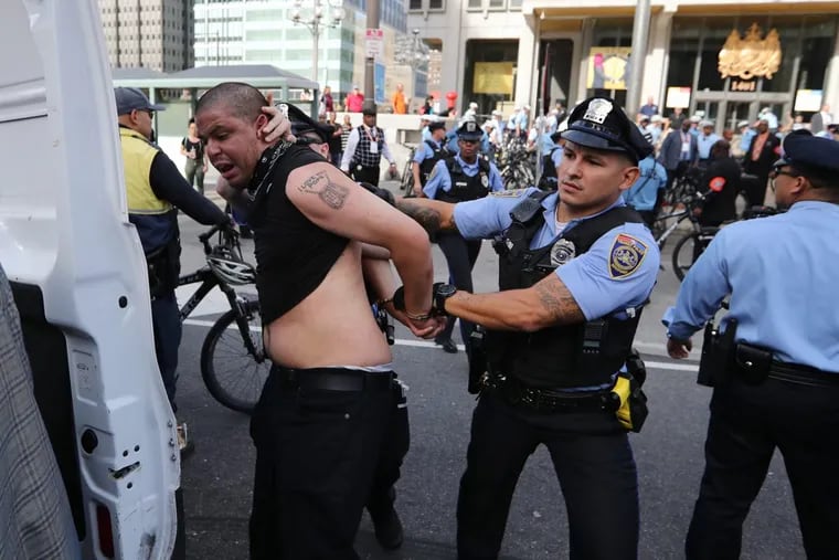 Anti-police protests turned from peaceful to aggressive Saturday at the statue of former Mayor Frank L. Rizzo, leading to at least three injuries, two arrests and four citations.