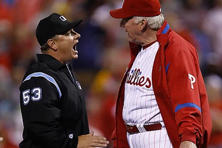 Greg Gibson ejected Charlie Manuel after an argument over whether Michael Bourn was tagged out at first. (Matt Rourke/AP)