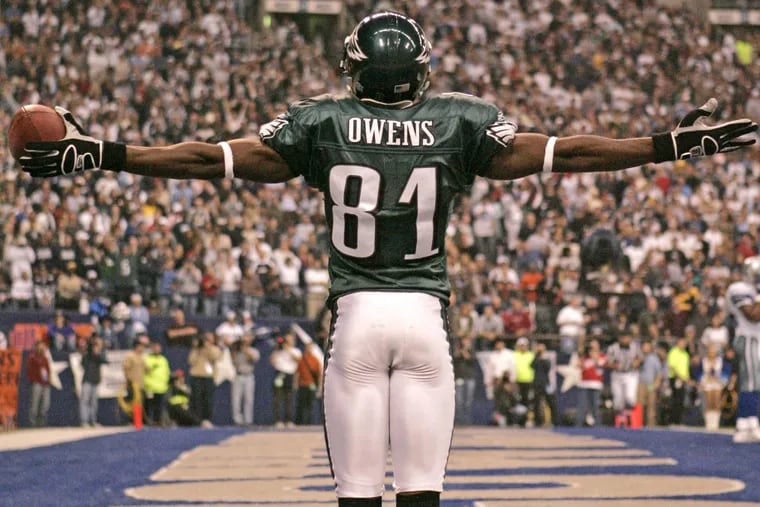 Eagles receiver Terrell Owens stands on the Dallas Cowboys star in the end zone as he celebrates his second quarter touchdown catch in 2004.