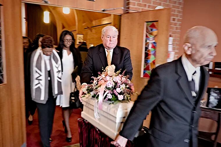 A few dozen mourners  at the Browns Mill United Methodist Church in Browns Mills NJ  pay their last respects to the one-day-old baby who was allegedly killed by her mother. After the service, two pall bearers wheeled the tiny coffin to the hearse followed by family and guests.  ( ED HILLE / Staff Photographer )