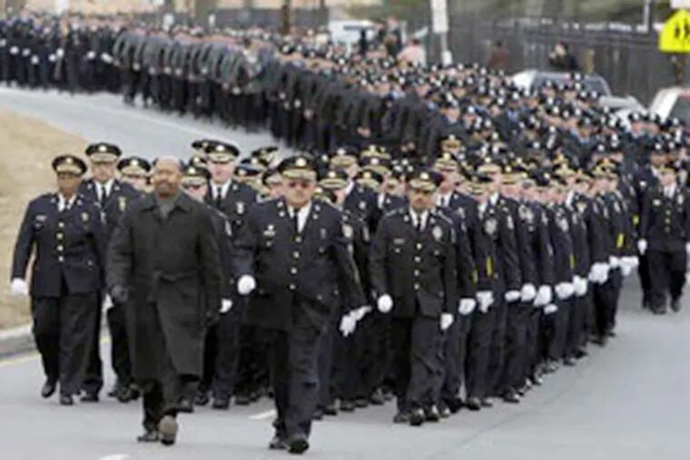 Police, led by Mayor Nutter and Commissioner Charles H. Ramsey, march to the John F. Givnish Funeral Home for the viewing of Officer John Pawlowski. (Elizabeth Robertson / Staff Photographer.