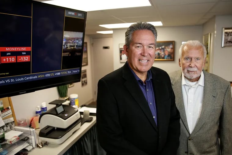 Two Hands are better than one: Joe Hand Jr., left, and Joe Hand Sr., see an opportunity in legalized sports betting: They are distributing a new service, KonekTV, to bars that will stream betting information and other content, allowing sports bars to becom virtual sportsbooks.