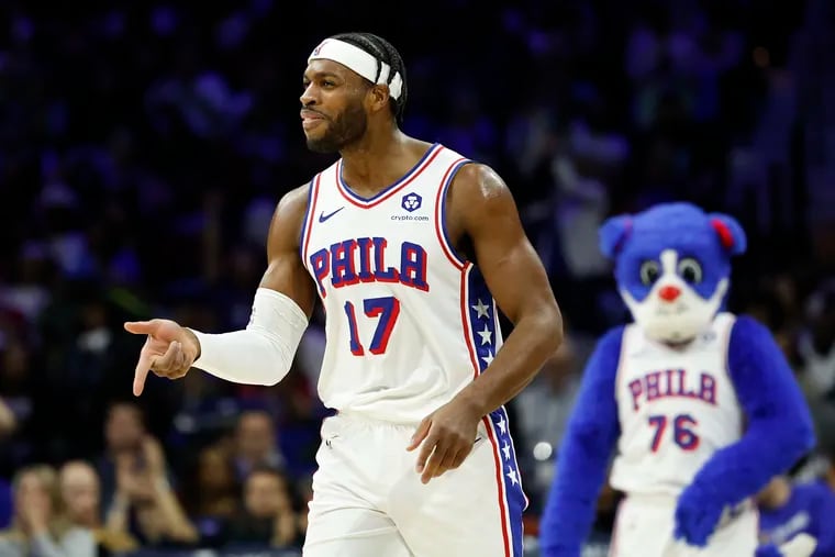 Sixers guard Buddy Hield points his finger after making a three-point basket in the third quarter against the Brooklyn Nets on Sunday, April 14, 2024 in Philadelphia.