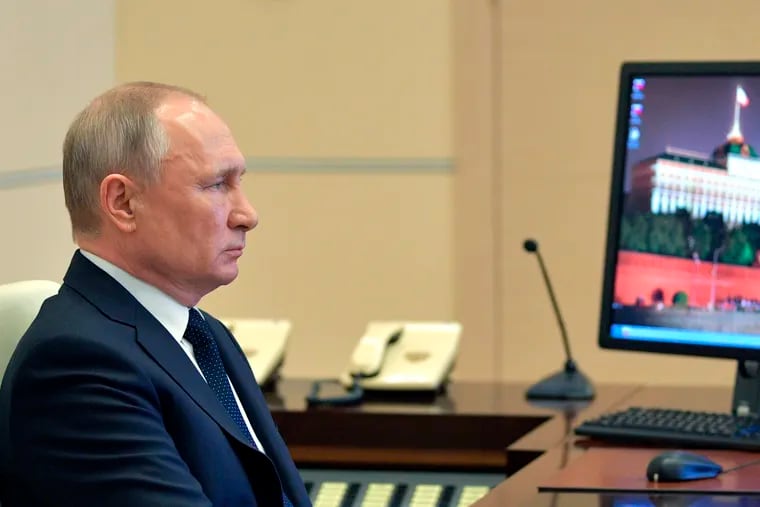 Russian President Vladimir Putin attend a meeting via video conference with heads of local governments at the Novo-Ogaryovo residence outside Moscow, Russia, Wednesday, April 8, 2020. The new coronavirus causes mild or moderate symptoms for most people, but for some, especially older adults and people with existing health problems, it can cause more severe illness or death. (Alexei Druzhinin, Sputnik, Kremlin Pool Photo via AP)