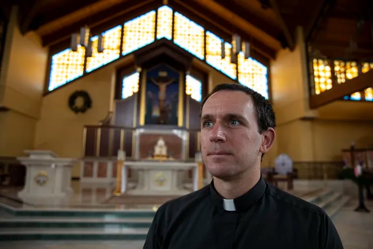 Father Ianelli, 34, of Northeast Philadelphia, Parochial Vicar at Our Lady of Guadalupe, poses for a portrait inside the Nave where the church services are held. Our Lady of Guadalupe, a Catholic church tucked away in the hills near Doylestown, has been the victim of multiple acts of vandalism in the last few years. And even as local police search for the people responsible, with Christmas approaching, the parish's faith leaders are offering forgiveness.