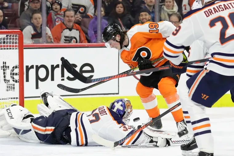 Flyers center Nolan Patrick watches the loose puck against Edmonton Oilers goaltender Cam Talbot and center Leon Draisaitl during the third-period on Saturday, February 2, 2019 in Philadelphia.