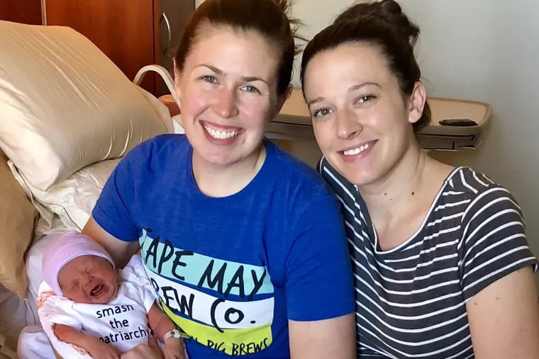 Katie (left) and Megan MacTurk with infant Kieran just before leaving the hospital.